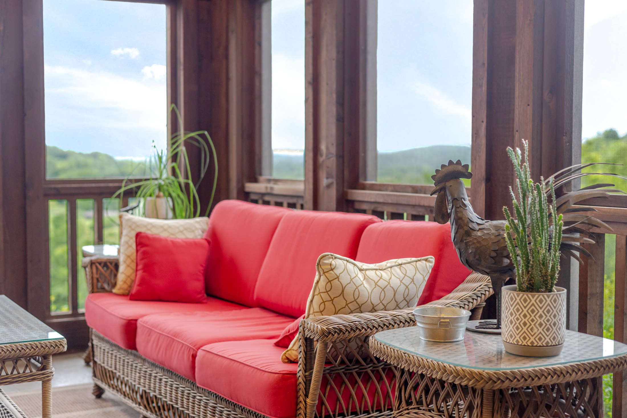 Red porch seating looking out to the land