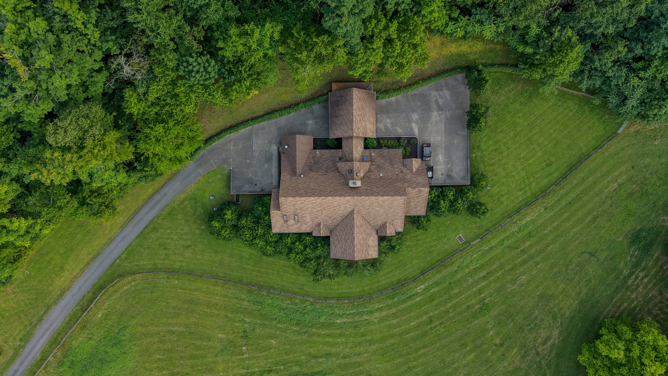 Overhead view of the home and curved driveway