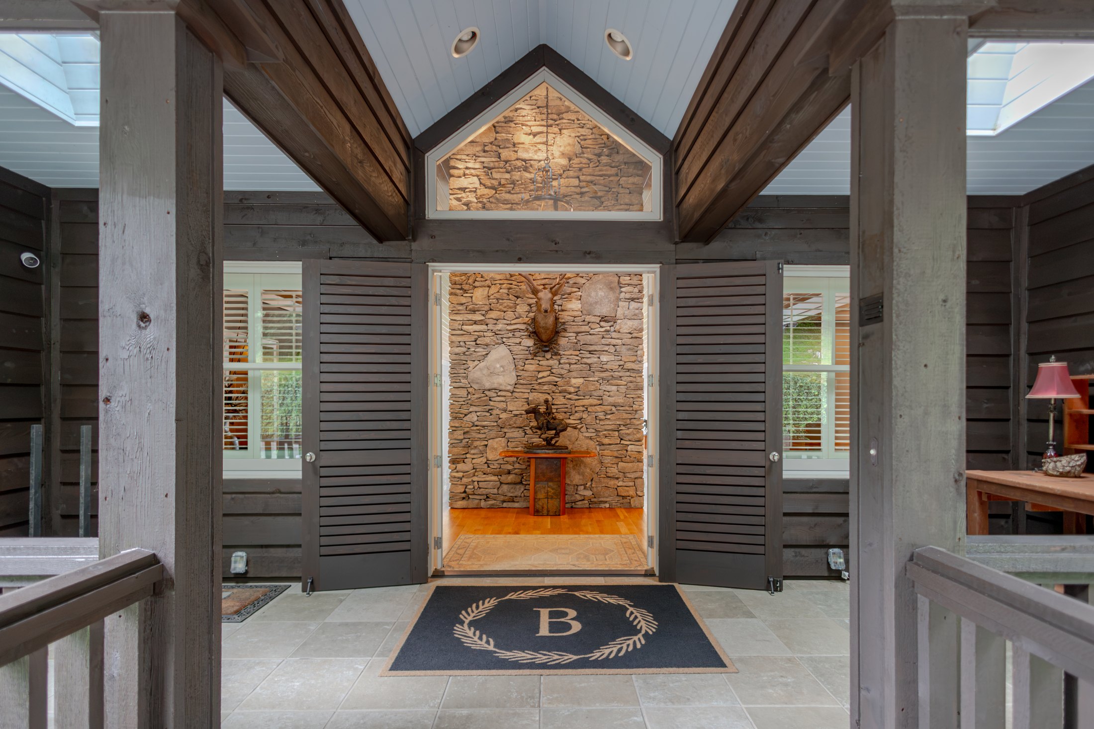 Vaulted entry with timber detailing