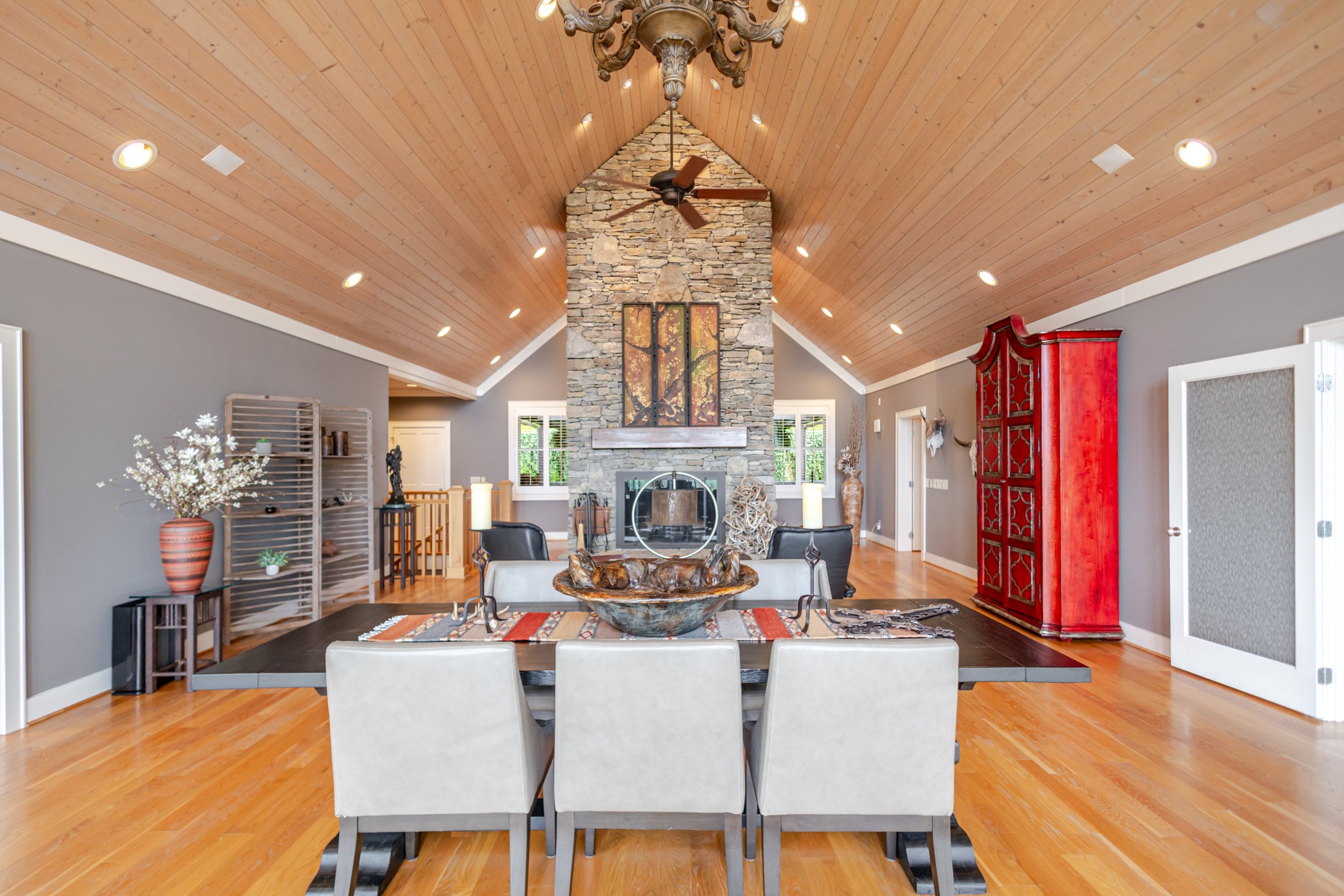 Open living space around the stone fireplace