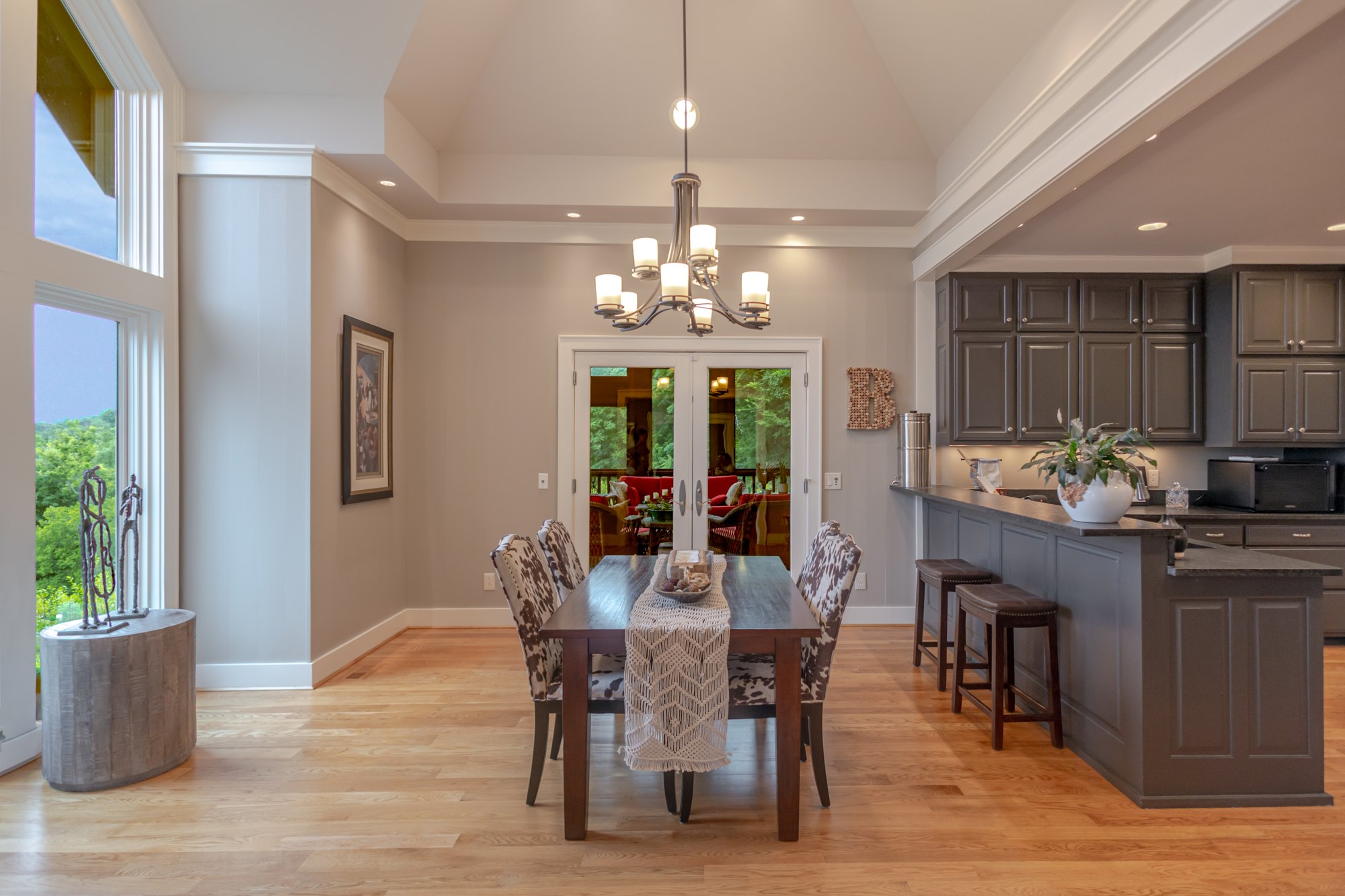 Dining room opening to the wooded view