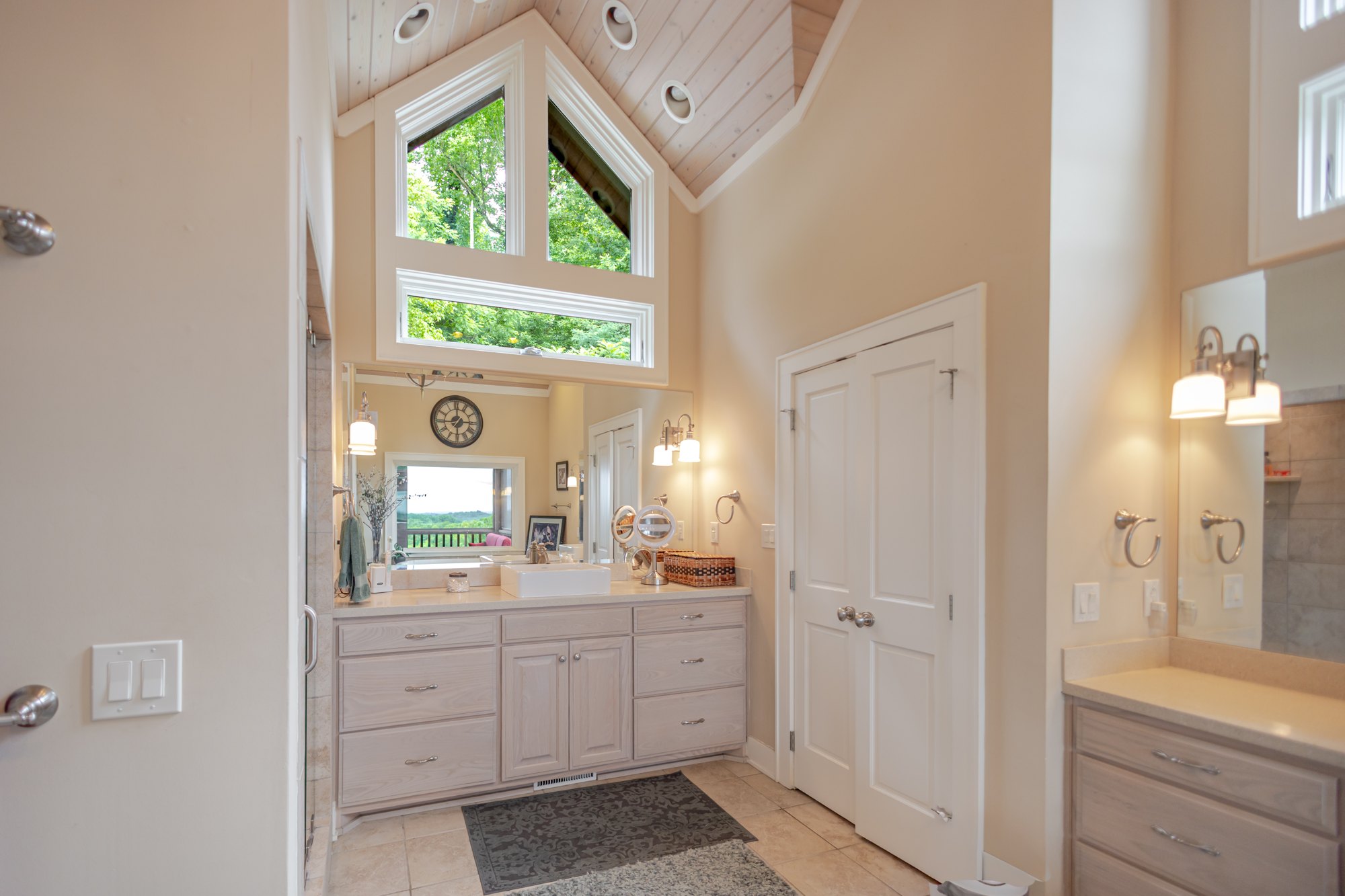 Bathroom with tall windows and freestanding tub