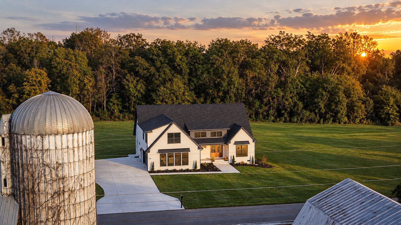 A bold silhouette against a Tennessee sunset. Inside, dark cabinetry, clean lines, and natural wood bring a quieter kind of contrast.