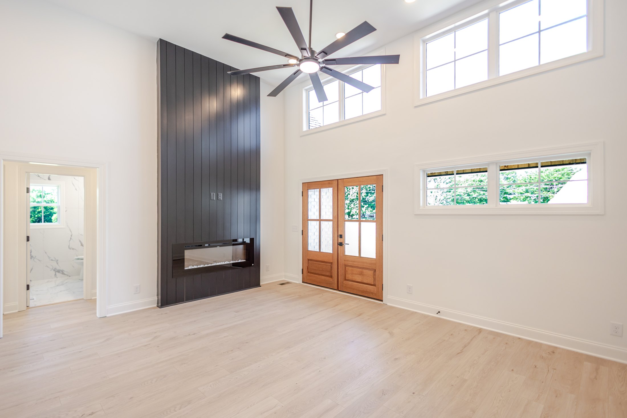 Double-height entry with a dark feature wall
