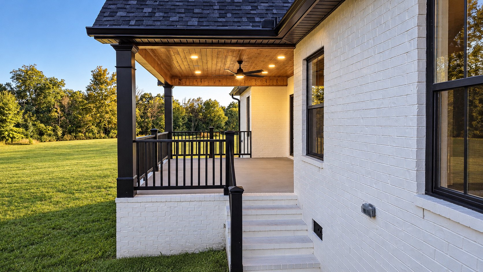 Covered front porch overlooking the lawn