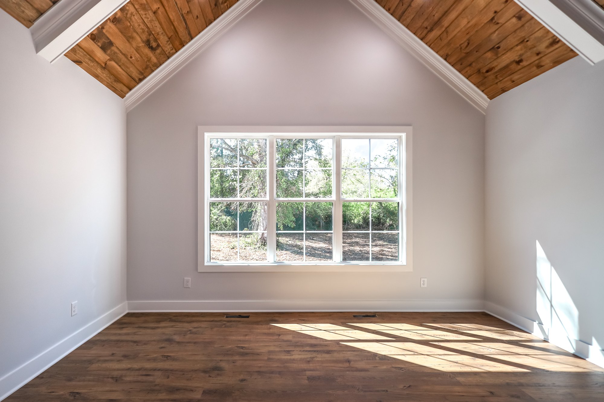 Sunlight across a vaulted bedroom