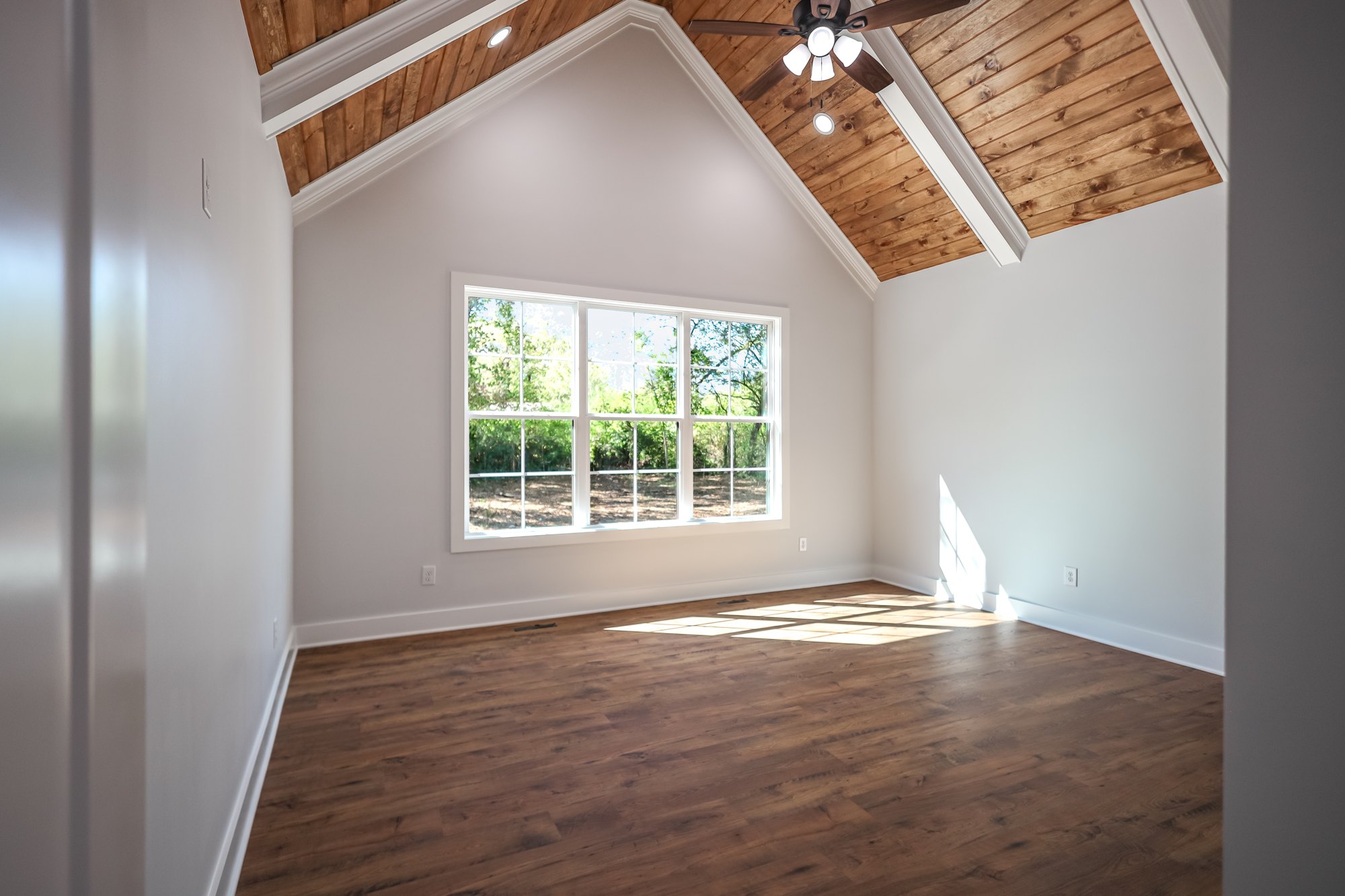 Vaulted bedroom with timber ceiling