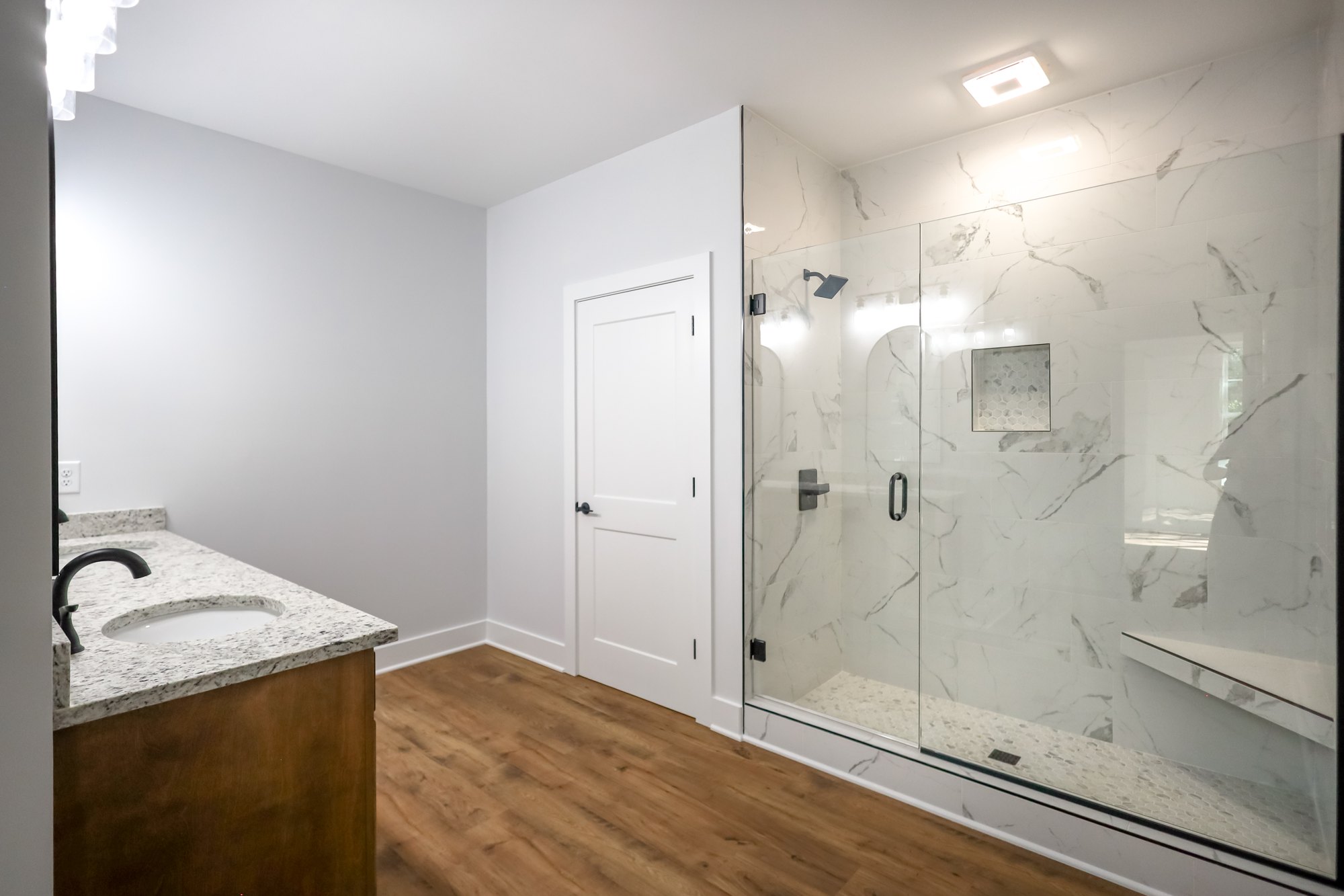 Bathroom with freestanding tub and glass shower