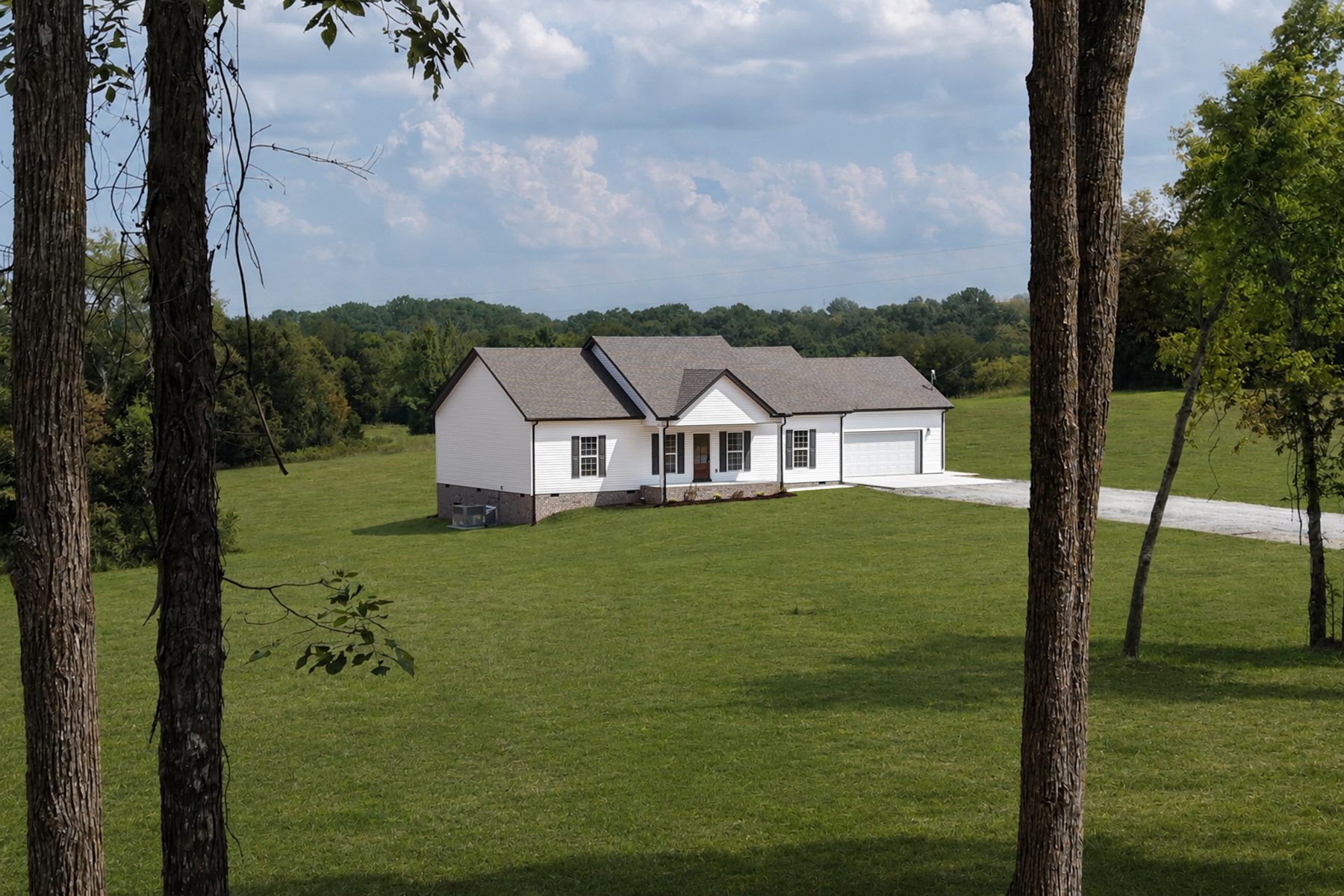 852 Lower Halls Mill Road — framed by trees